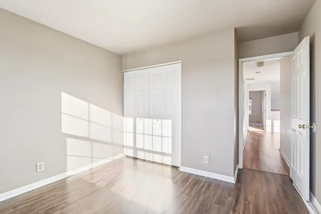 a view of wooden floor in an empty room