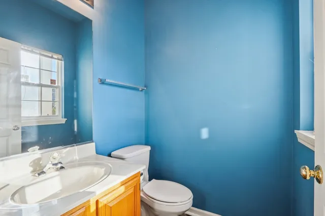 a bathroom with a sink a toilet and tub