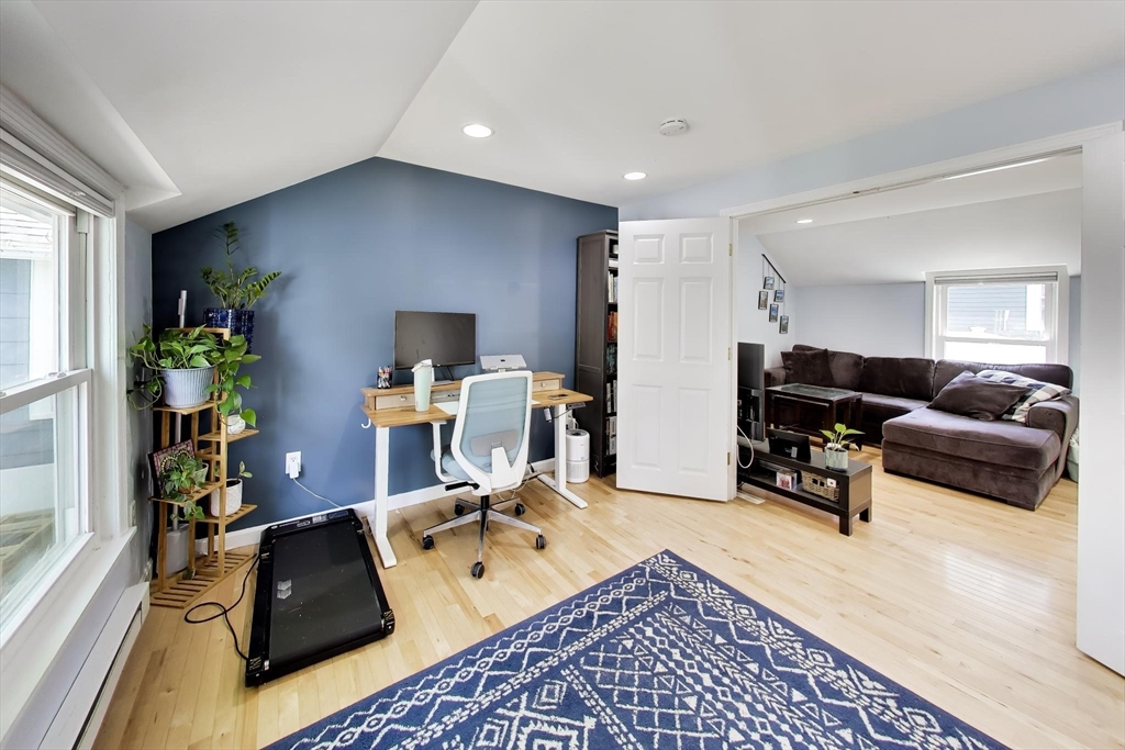 22 Douglas Road Ashland, MA 01721 - Photo 8 of 24 a living room with furniture and a flat screen tv
