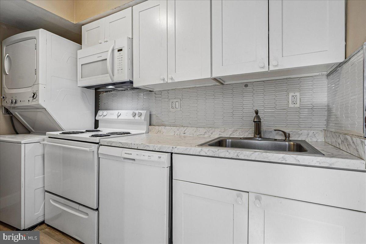 2015 38th Street Southeast, Unit B Washington, DC 20020 - Photo 13 of 30 a kitchen with stainless steel appliances granite countertop white cabinets sink and dishwasher