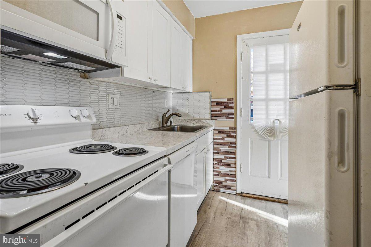 2015 38th Street Southeast, Unit B Washington, DC 20020 - Photo 15 of 30 a kitchen with a stove and a refrigerator