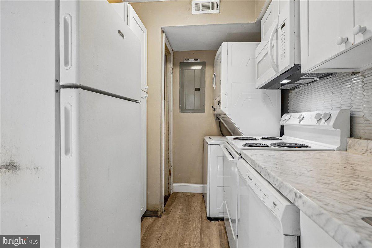 2015 38th Street Southeast, Unit B Washington, DC 20020 - Photo 16 of 30 a kitchen with stainless steel appliances granite countertop white refrigerator a stove and a sink