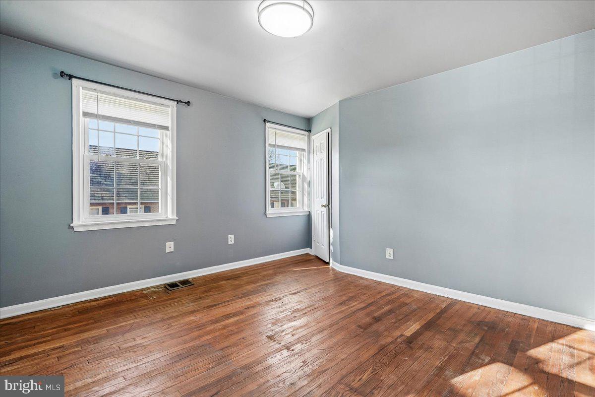 2015 38th Street Southeast, Unit B Washington, DC 20020 - Photo 20 of 30 a view of empty room with wooden floor and fan