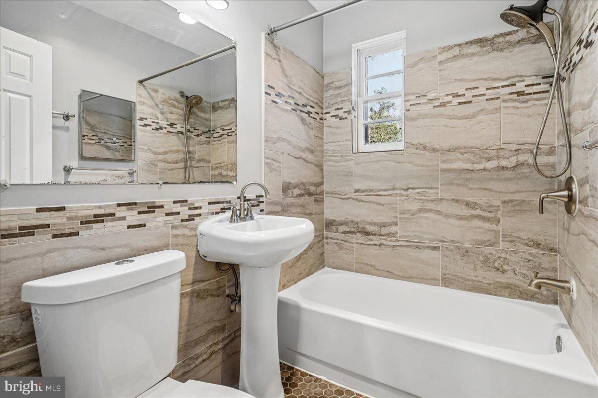 2015 38th Street Southeast, Unit B Washington, DC 20020 - Photo 23 of 30 a bathroom with a sink a toilet and bathtub