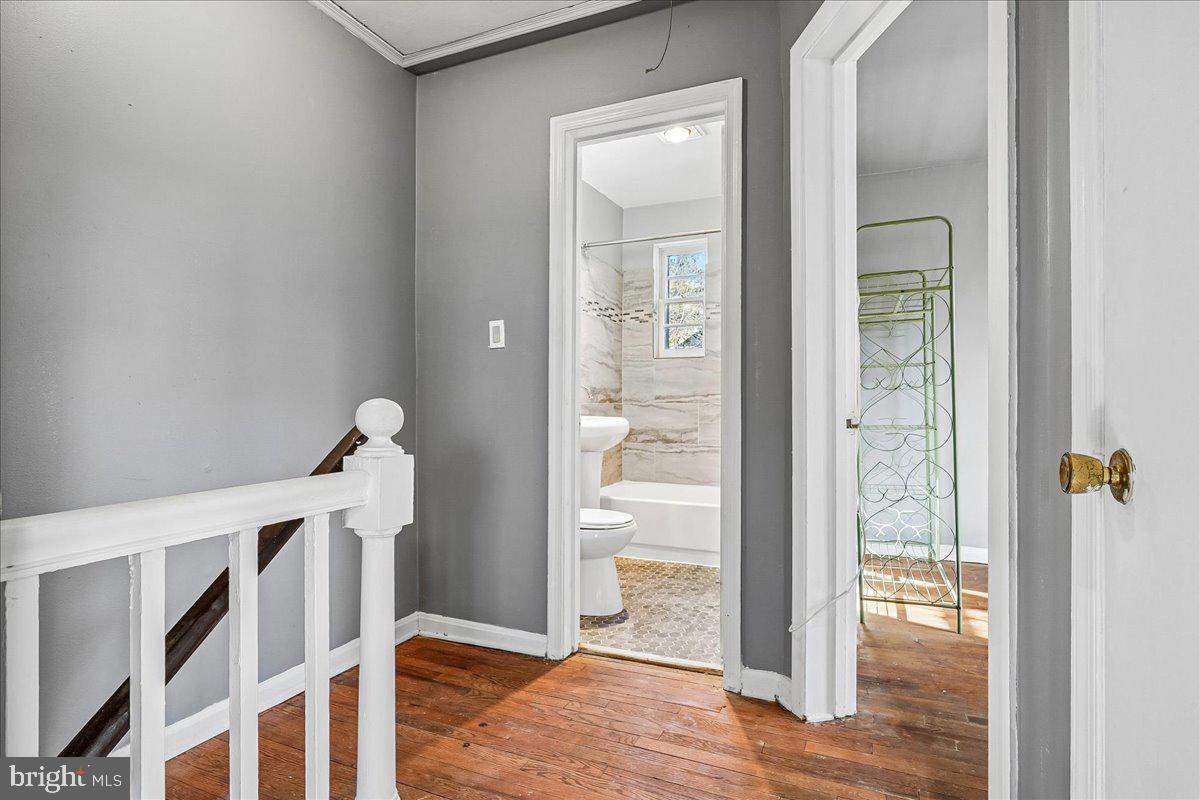 2015 38th Street Southeast, Unit B Washington, DC 20020 - Photo 24 of 30 a view of a hallway with wooden floor and entryway
