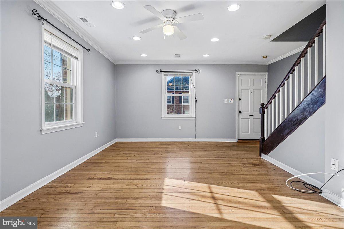 2015 38th Street Southeast, Unit B Washington, DC 20020 - Photo 7 of 30 a view of an empty room with wooden floor and a window