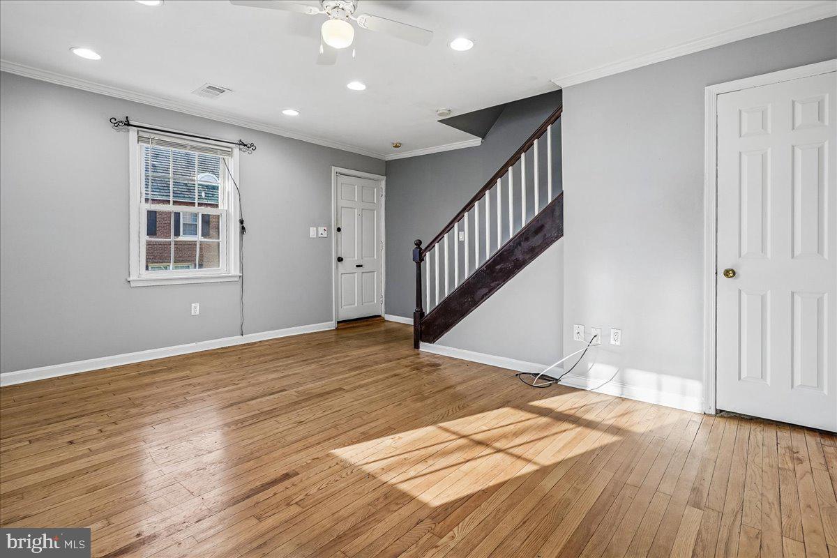2015 38th Street Southeast, Unit B Washington, DC 20020 - Photo 8 of 30 a view of empty room with wooden floor and fan
