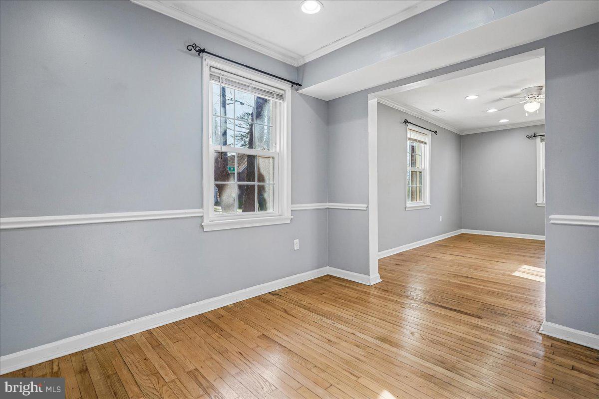 2015 38th Street Southeast, Unit B Washington, DC 20020 - Photo 9 of 30 a view of empty room with wooden floor and fan