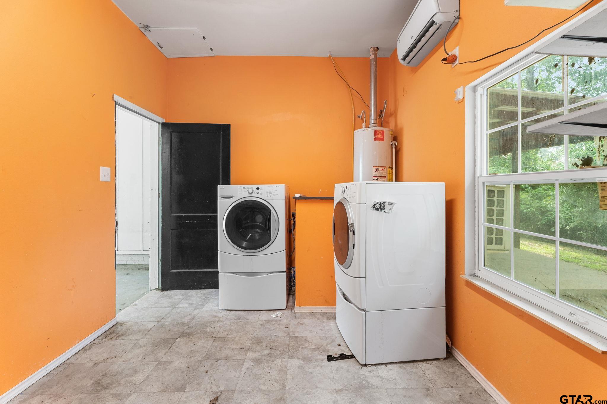 2811 Rollingwood Drive Tyler, TX 75701 - Photo 28 of 28 a utility room with dryer and washer