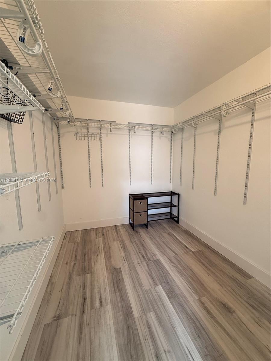 10875 Northwest 7th Street, Unit 1136 Miami, FL 33172 - Photo 19 of 25 a view of empty room with wooden floor