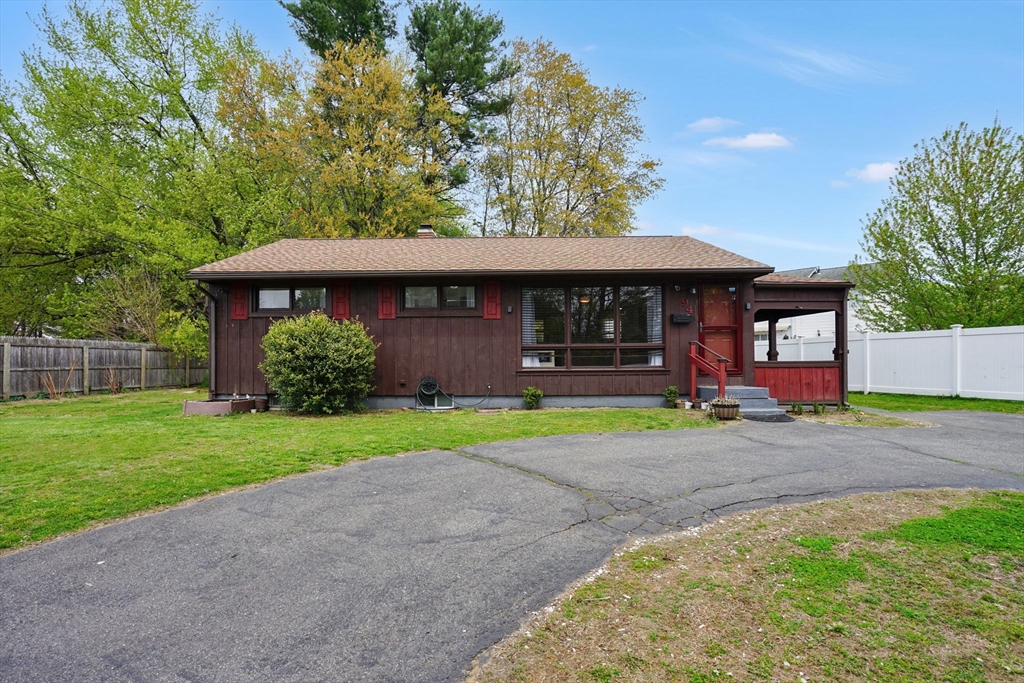 94 Cora Avenue Chicopee, MA 01013 - Photo 1 of 41 a front view of a house with garden