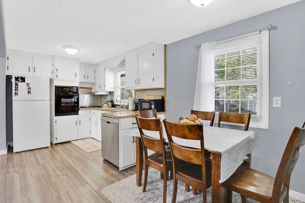 94 Cora Avenue Chicopee, MA 01013 - Photo 12 of 41 a view of kitchen with cabinets and wooden floor