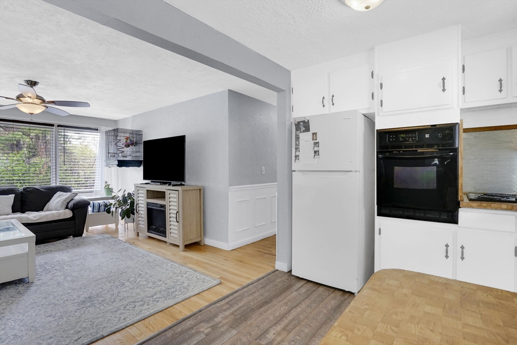 94 Cora Avenue Chicopee, MA 01013 - Photo 19 of 41 a kitchen with stainless steel appliances refrigerator stove and microwave