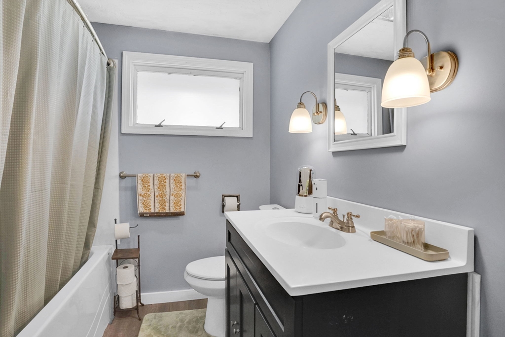 94 Cora Avenue Chicopee, MA 01013 - Photo 25 of 41 a bathroom with a sink a toilet and a mirror