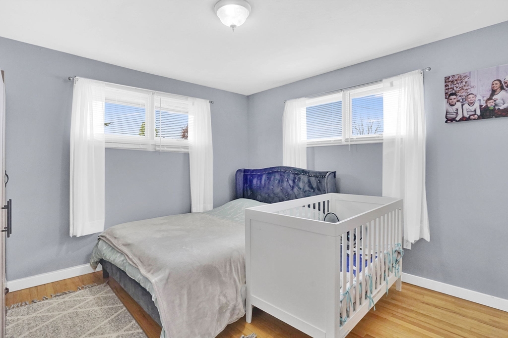 94 Cora Avenue Chicopee, MA 01013 - Photo 29 of 41 a bedroom with a bed and a window