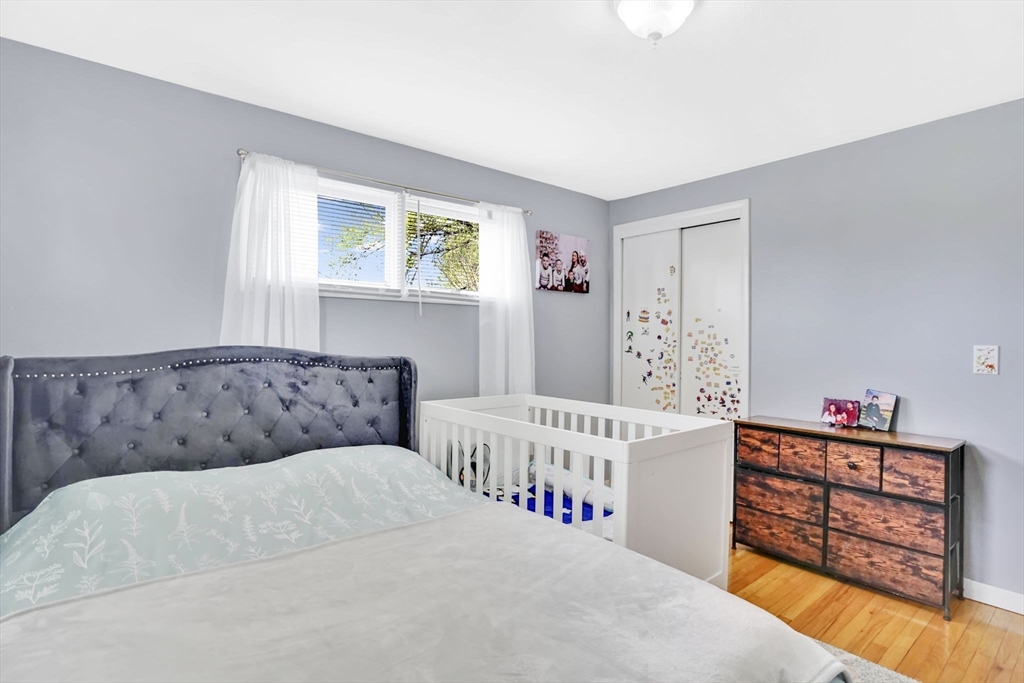 94 Cora Avenue Chicopee, MA 01013 - Photo 31 of 41 a bedroom with furniture and a wooden floor