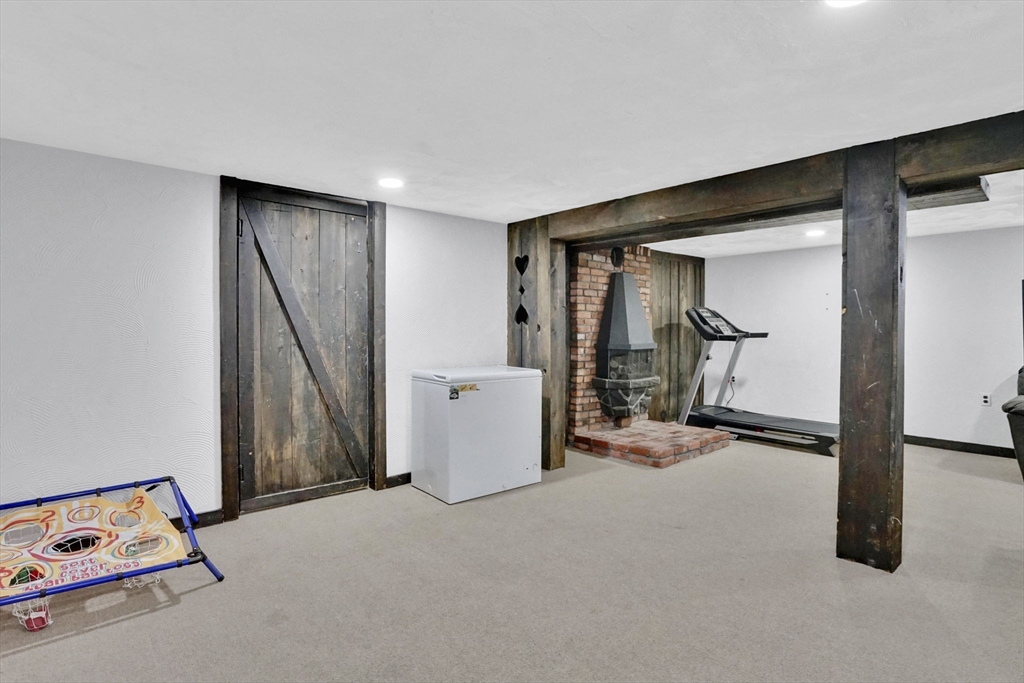 94 Cora Avenue Chicopee, MA 01013 - Photo 35 of 41 a view of a room with gym equipment and a window