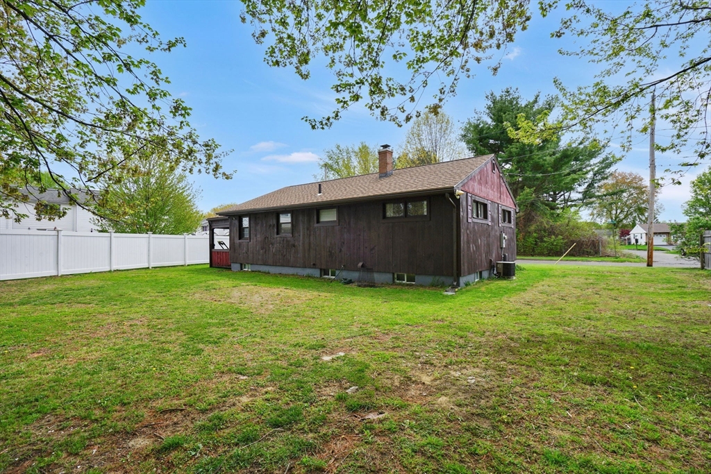 94 Cora Avenue Chicopee, MA 01013 - Photo 5 of 41 a view of a house with a garden