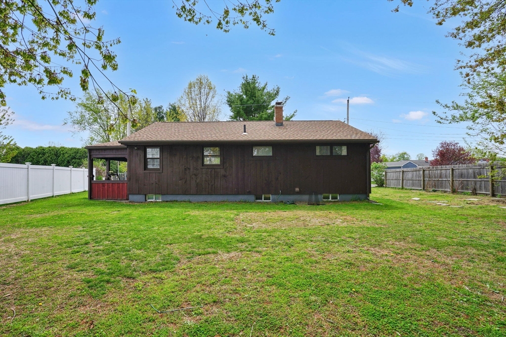 94 Cora Avenue Chicopee, MA 01013 - Photo 6 of 41 a front view of a house with a garden