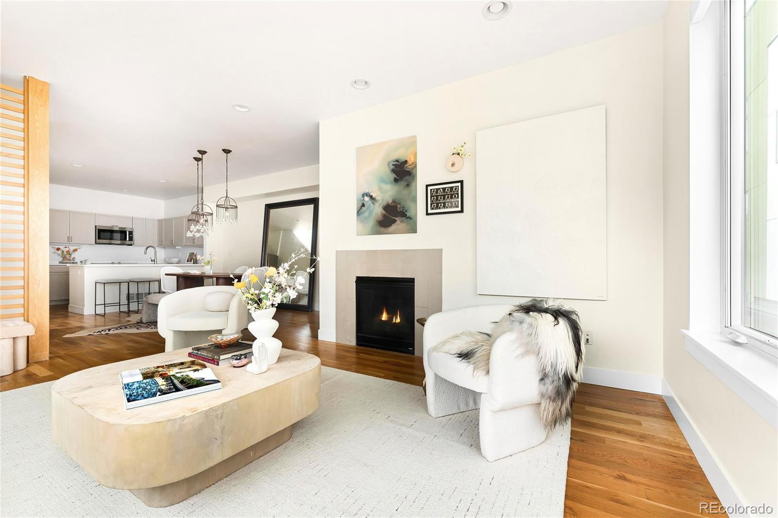 3166 Vallejo Street Denver, CO 80211 - Photo 12 of 50 a living room with furniture and a fireplace