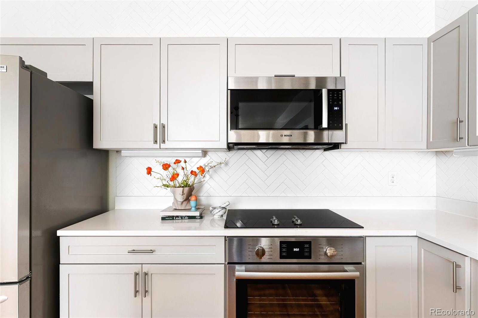 3166 Vallejo Street Denver, CO 80211 - Photo 14 of 50 a stove top oven sitting inside of a kitchen