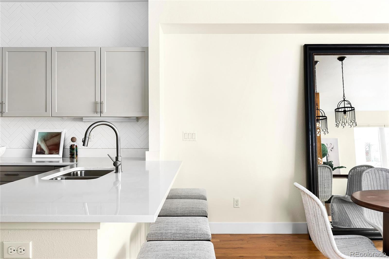 3166 Vallejo Street Denver, CO 80211 - Photo 17 of 50 a view of a room with a sink and mirror
