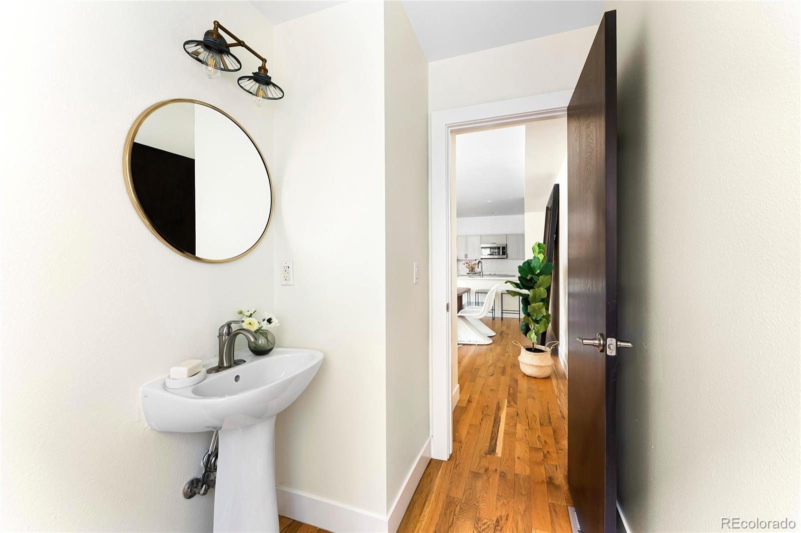 3166 Vallejo Street Denver, CO 80211 - Photo 22 of 50 a bathroom with a sink and mirror