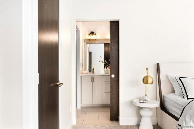 a view of a hallway with furniture and cabinet