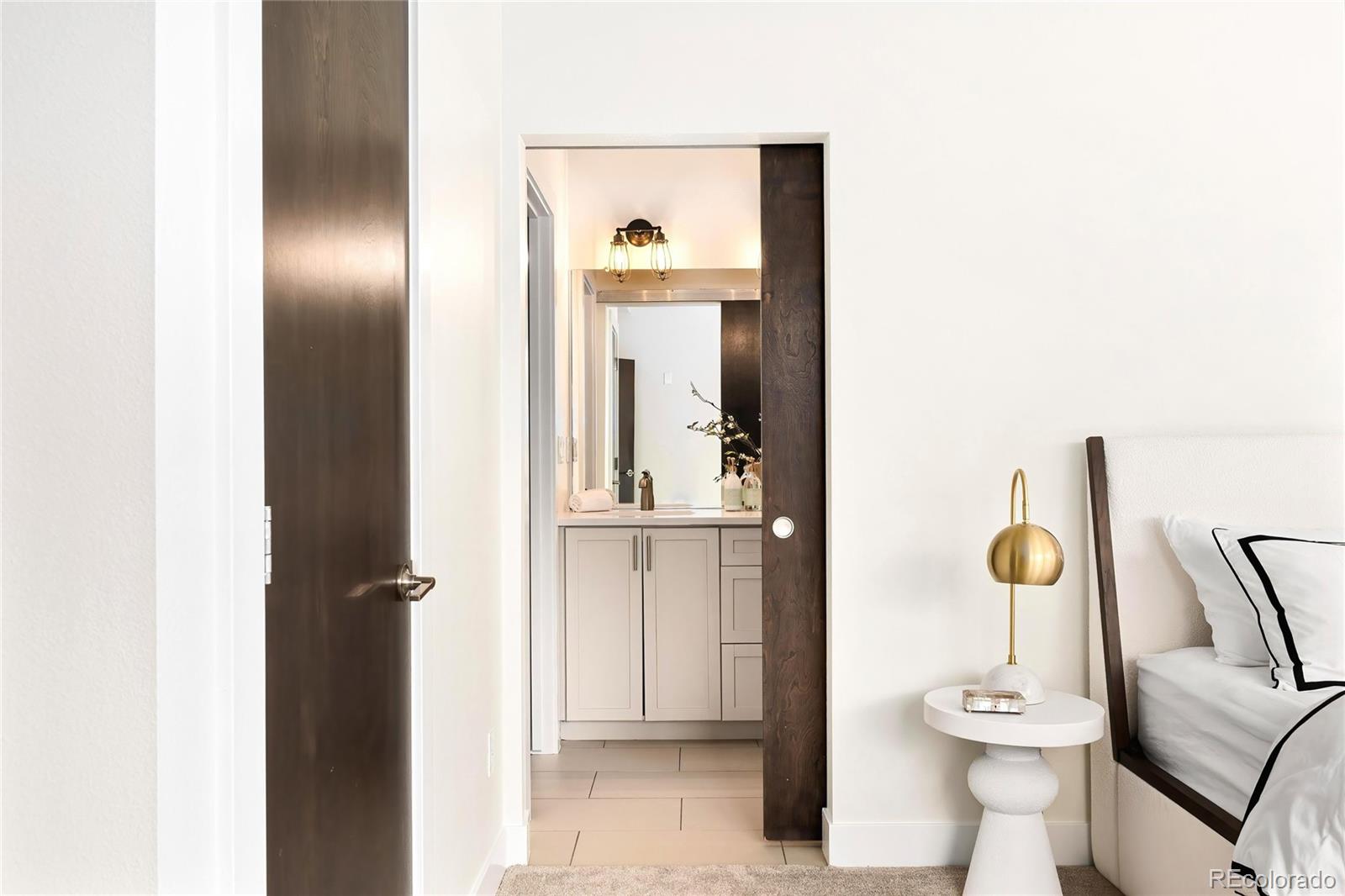 3166 Vallejo Street Denver, CO 80211 - Photo 26 of 50 a view of a hallway with furniture and cabinet