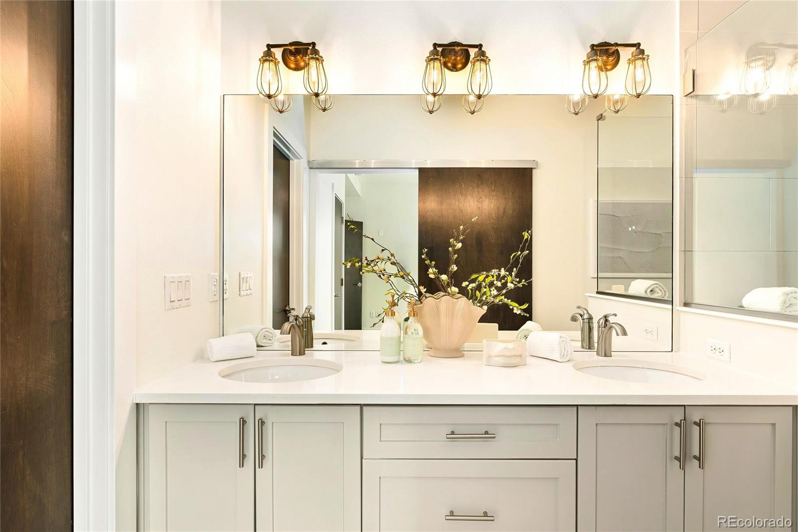 3166 Vallejo Street Denver, CO 80211 - Photo 27 of 50 a bathroom with a sink and a mirror