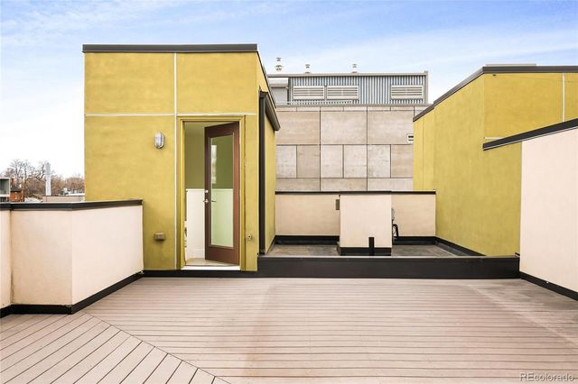a living room with a wooden floor and a table