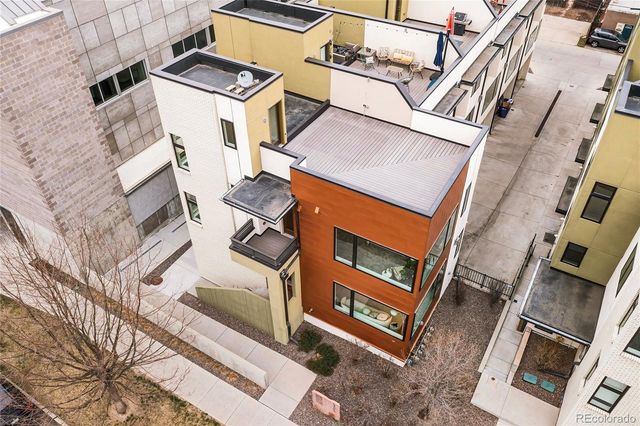 a view of a patio with a table and chairs