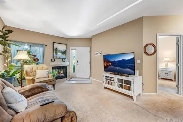 a view of livingroom with furniture and workspace