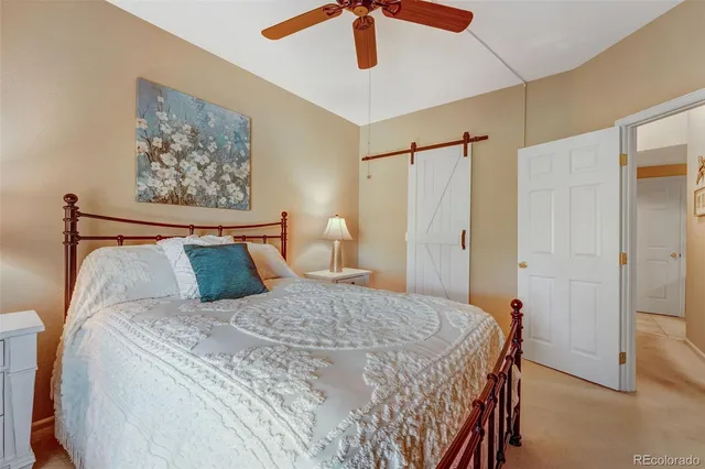 a bed room with a bed and a flat screen tv