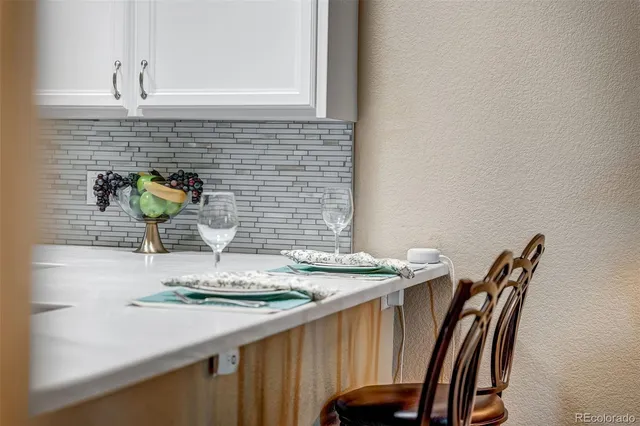 a close view of dining table and chairs