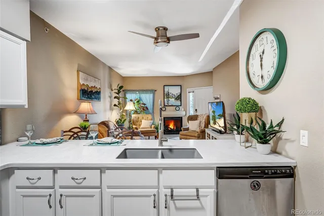 a very nice looking room with a large mirror and a sink