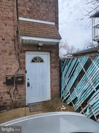 a front view of a house with parking area