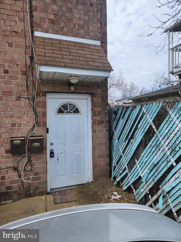 a front view of a house with parking area