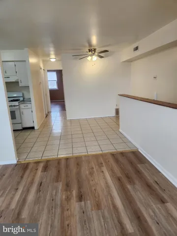 a view of a kitchen from the hallway