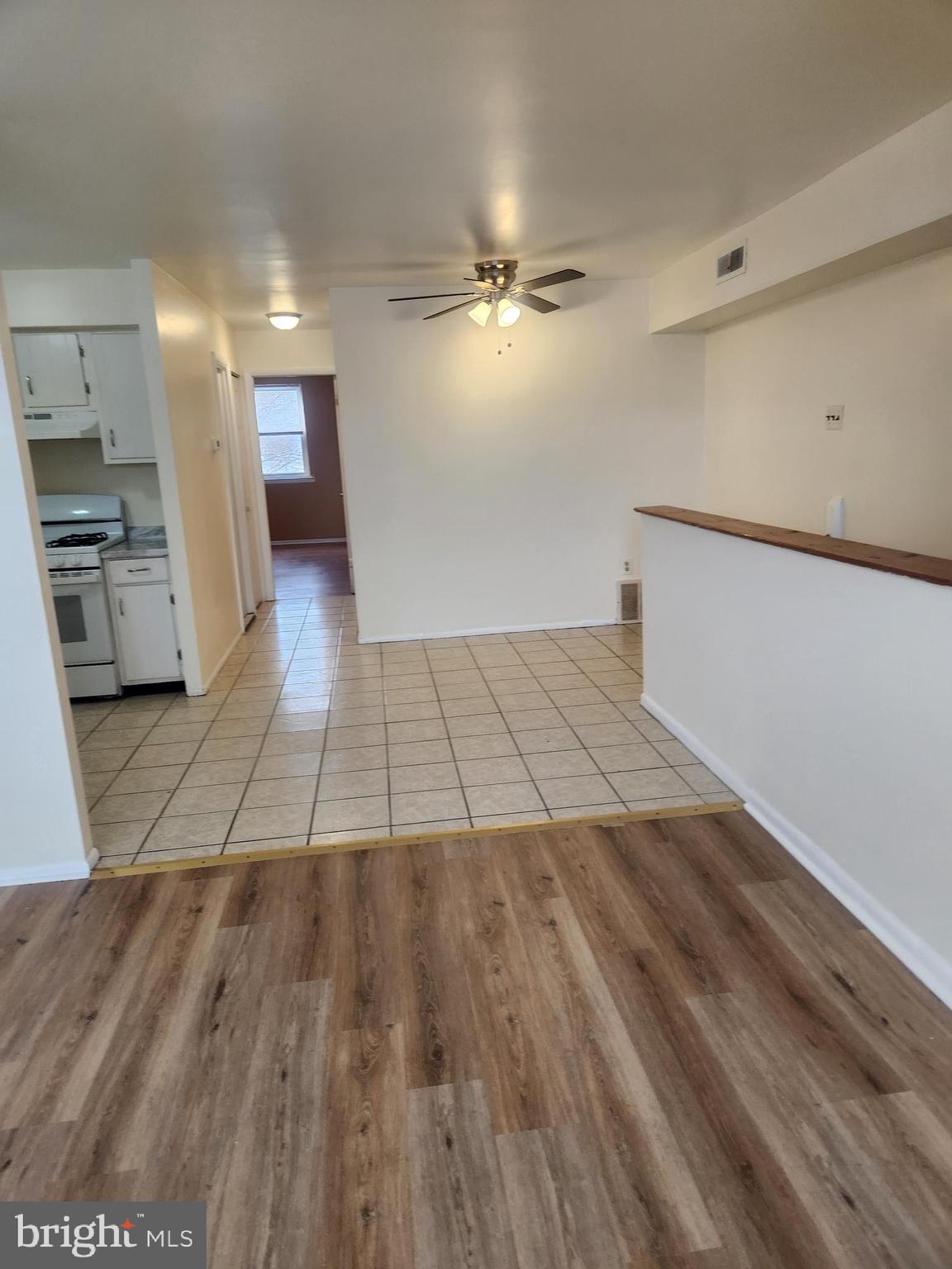4320 Howell Street, Unit 1 Philadelphia, PA 19135 - Photo 5 of 19 a view of a kitchen from the hallway