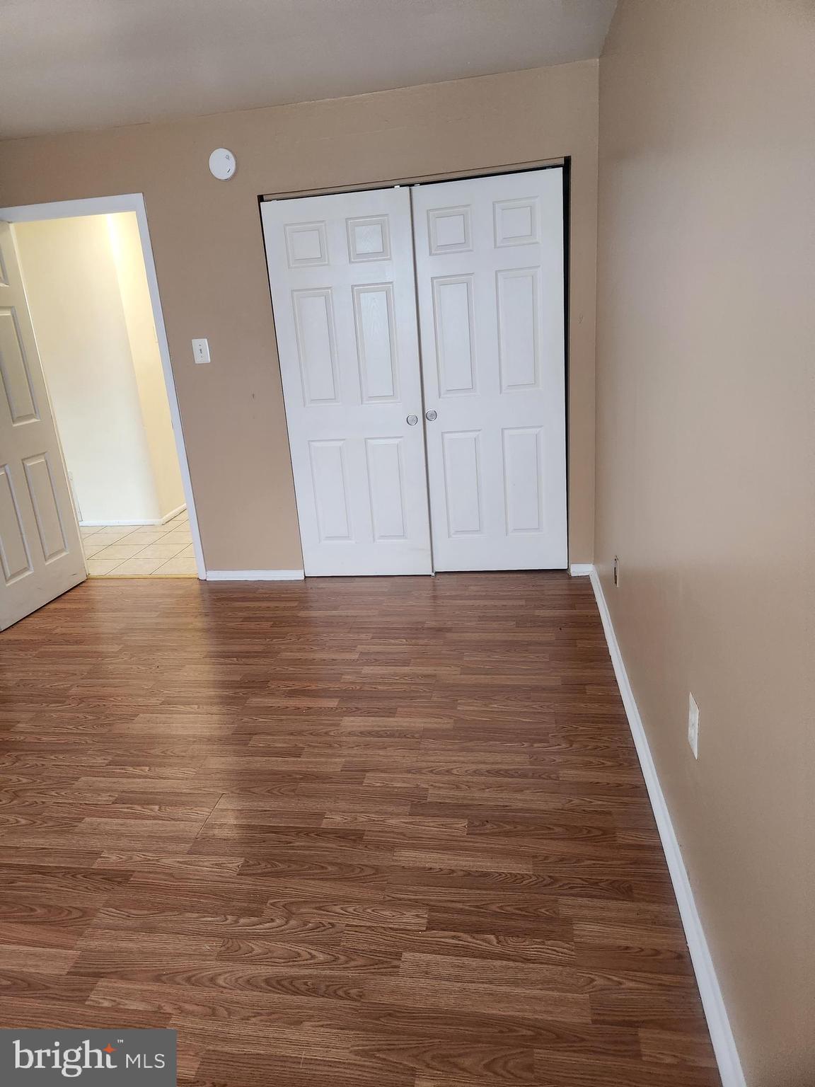 4320 Howell Street, Unit 1 Philadelphia, PA 19135 - Photo 10 of 19 a view of an empty room with wooden floor