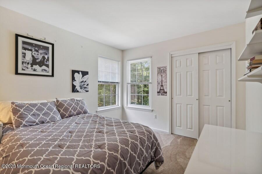 14 Goldfinch Road Jackson, NJ 08527 - Photo 19 of 26 a bedroom with a large bed and a window