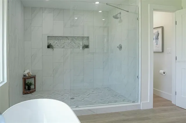 a bathroom with a shower and a sink