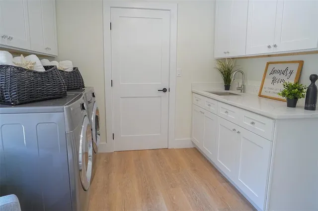 a kitchen with a refrigerator and cabinets
