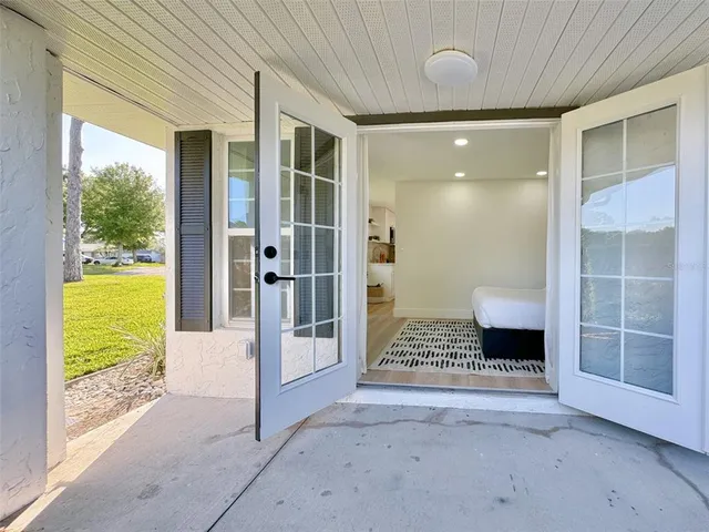 a view of a glass door with a balcony