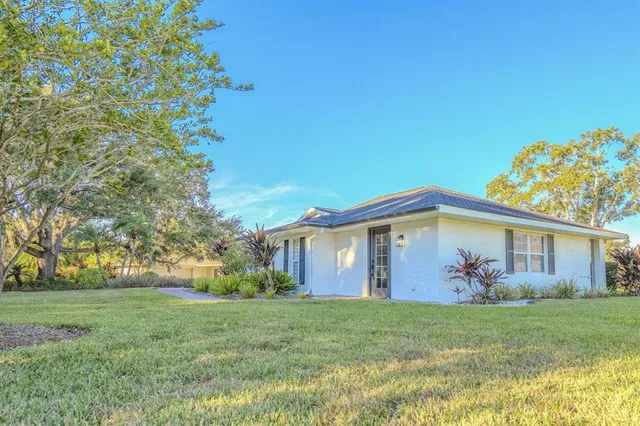a backyard of a house with lots of green space