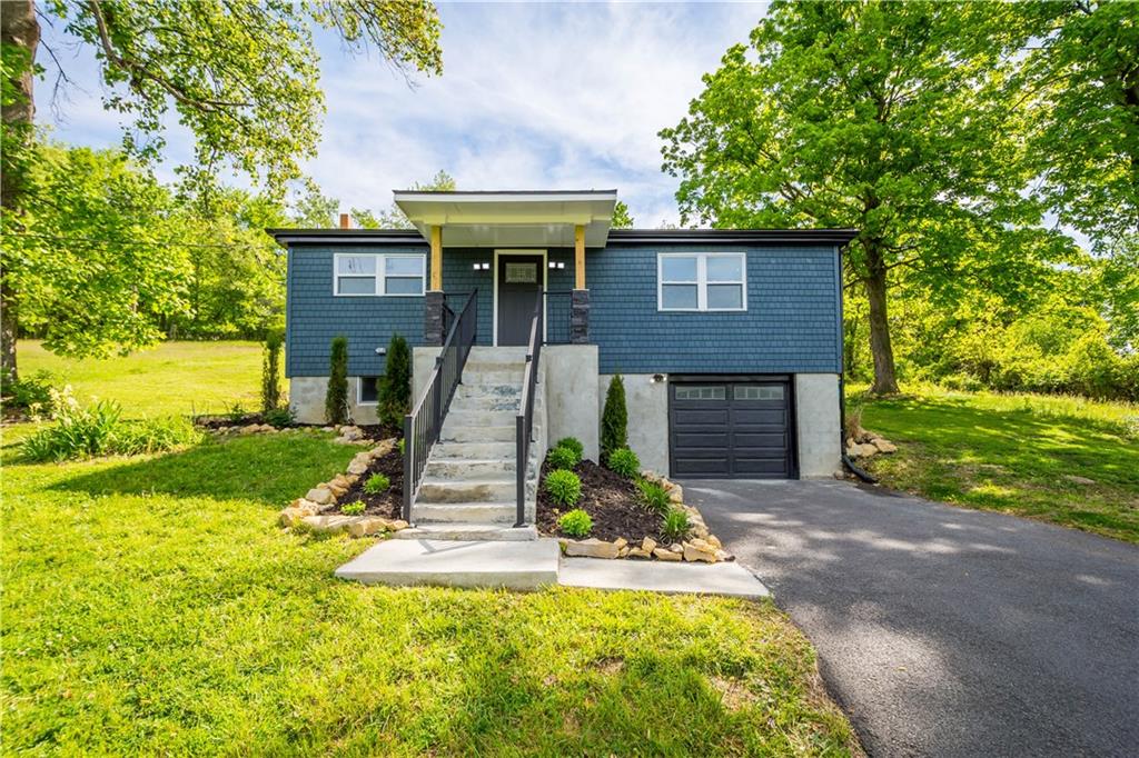 933 Boyce Road Bridgeville, PA 15017 - Photo 5 of 36 a front view of a house with garden