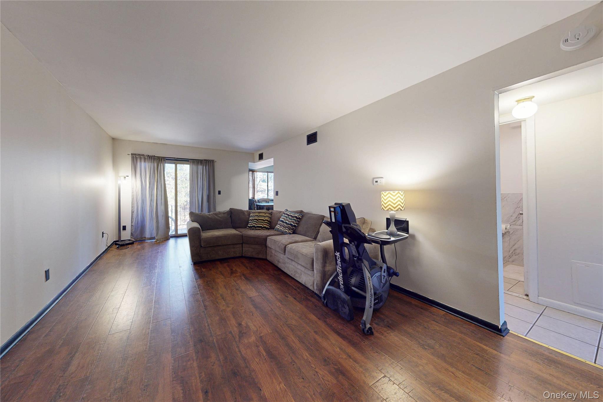 26 Cooper Road, Unit 914 Poughkeepsie, NY 12603 - Photo 4 of 19 Living Room featuring luxury laminate flooring