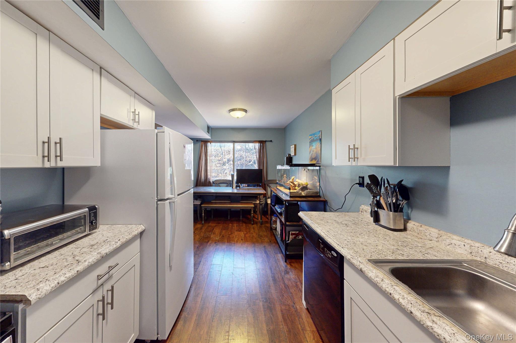 26 Cooper Road, Unit 914 Poughkeepsie, NY 12603 - Photo 6 of 19 Updated Kitchen featuring white cabinetry and breakfast nook