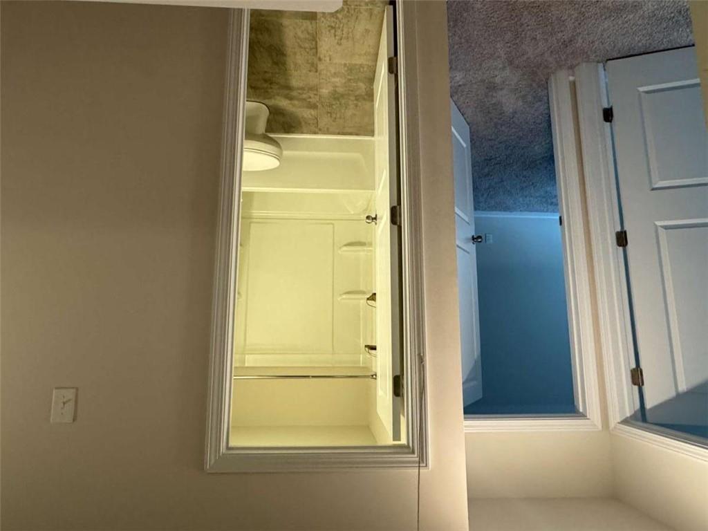 3376 Highbury Way Stonecrest, GA 30038 - Photo 12 of 28 a view of a bathroom with a glass door
